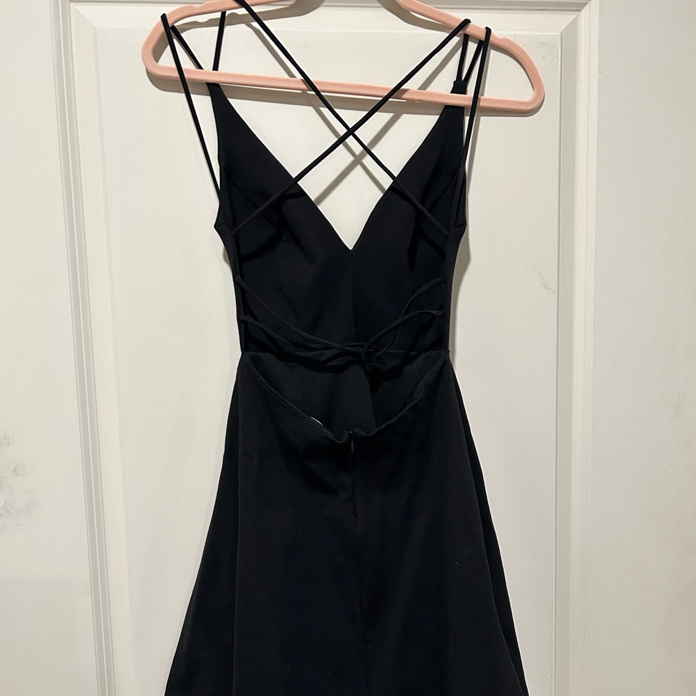 Lulus little black dress with cross strap back. Size small. Worn once like new.